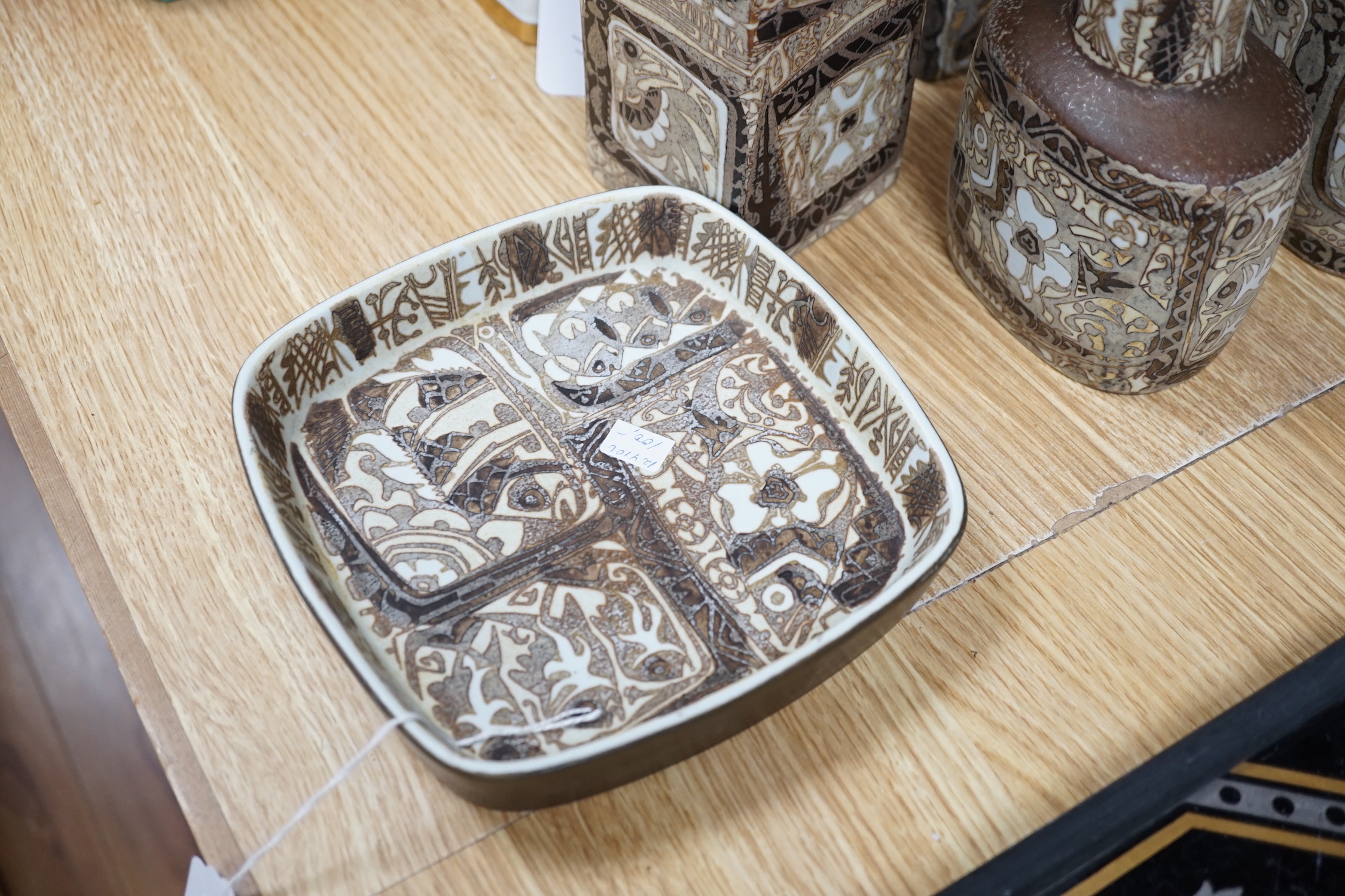 Nine Royal Copenhagen ceramic items by Nils Thorssen including; five, shallow, square section, dishes, a rectangular section vase, a square section vase, an oval section vase, and a lidded pot, tallest 22cm